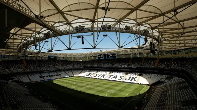 The Besiktas football stadium seating bowl with the Bosphorus visible behind it