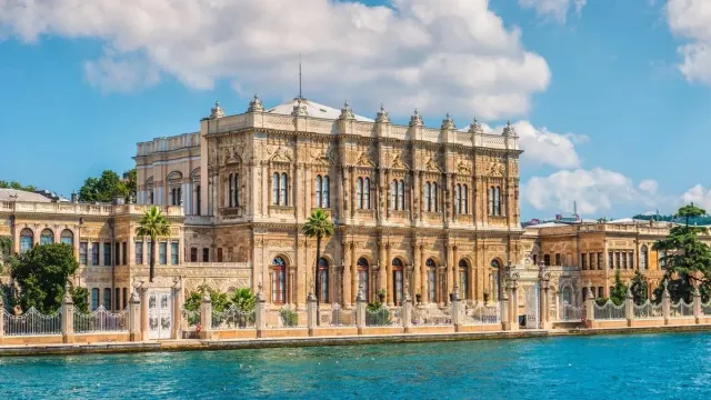 The white Baroque facade of Dolmabahce Palace along the Bosphorus waterfront