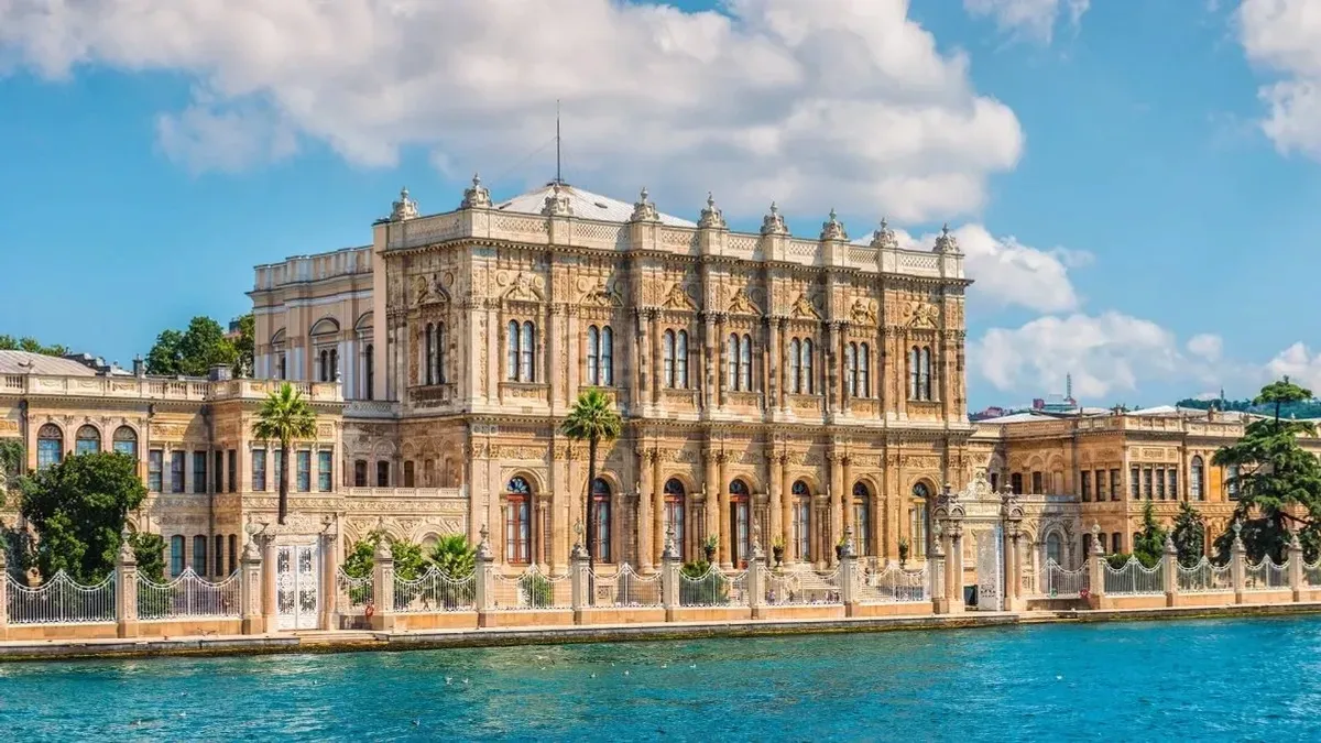 The white Baroque facade of Dolmabahce Palace along the Bosphorus waterfront