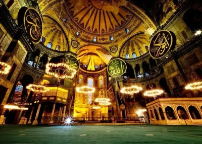 A tour guide pointing out mosaics to a small group inside Hagia Sophia