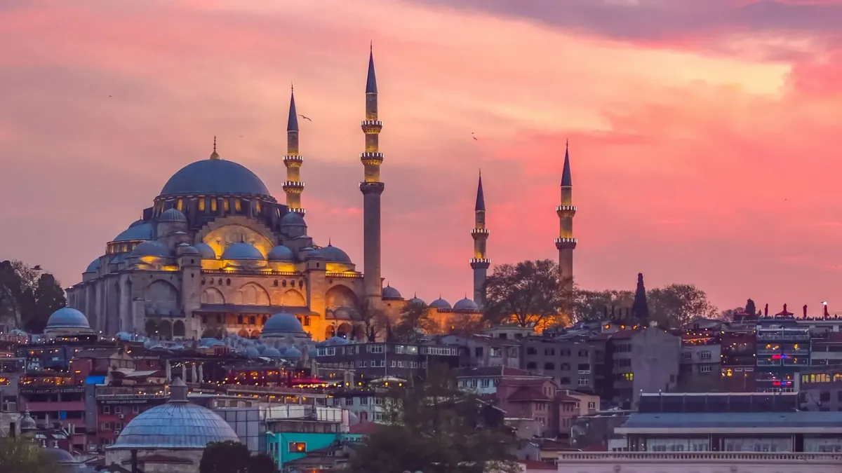 The vast central dome and courtyard of Suleymaniye Mosque at golden hour