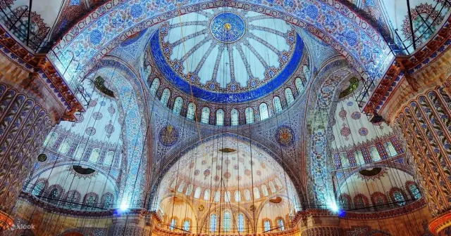 The six minarets and cascading domes of the Blue Mosque against a clear sky