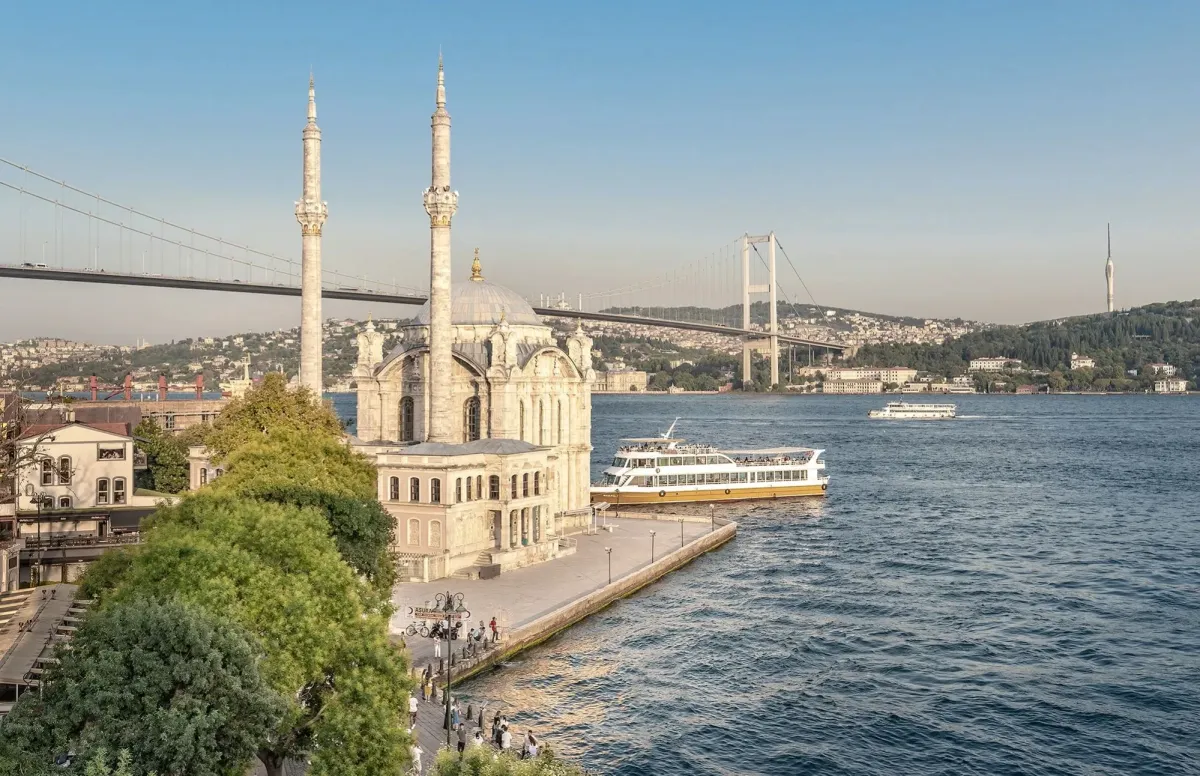 Ferries crossing the Bosphorus strait with the Istanbul skyline in the background