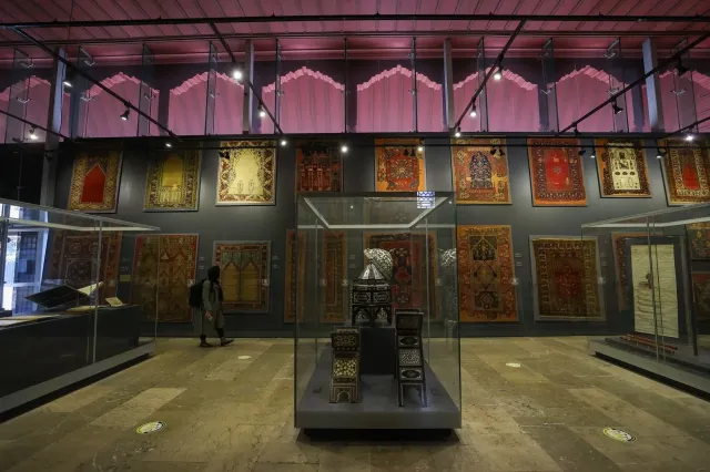 Antique Ottoman carpets displayed on the walls of the Turkish and Islamic Arts Museum